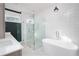 Elegant bathroom with soaking tub, walk-in shower, and modern fixtures at 130 2Nd Se Ave, Atlanta, GA 30317