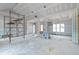 Unfinished living room in new construction home with high ceilings and fireplace at 3337 Horsley Mill Rd, Carrollton, GA 30116