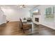 Living Room with fireplace, hardwood floors, and large windows at 1007 Alcovy River Ct, Loganville, GA 30052