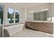 Elegant bathroom with double vanity, soaking tub, and walk-in shower at 2194 Bristol Cove # 13, Chamblee, GA 30341