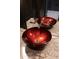 Close-up of a red glass vessel sink and modern faucet fixtures at 45 Ivan Allen Jr Nw Blvd # 2602, Atlanta, GA 30308