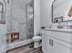 Modern bathroom with herringbone tile shower and white vanity at 6380 Cortland Walk, Alpharetta, GA 30005