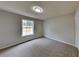 Bright bedroom featuring a large window and neutral decor at 101 Hickory Leaf Ln, Acworth, GA 30101
