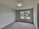 Well-lit bedroom with window view and neutral wall paint at 101 Hickory Leaf Ln, Acworth, GA 30101