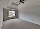 Main bedroom featuring carpeted floors and a large window at 101 Hickory Leaf Ln, Acworth, GA 30101