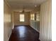 Dining room with hardwood floors and wood paneling at 6848 Church St, Lithonia, GA 30058
