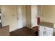 View of kitchen area with white cabinets and flooring at 6848 Church St, Lithonia, GA 30058