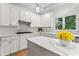 Modern kitchen with white cabinets, quartz countertops, and stainless steel appliances at 4510 Jenkins Way, Douglasville, GA 30135