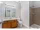 Clean bathroom with shower, vanity, and toilet at 5608 Baffin Rd, Atlanta, GA 30349