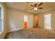 Large bedroom with carpeted floors and access to bathroom and closet at 1121 Whisper Wind Dr, Mcdonough, GA 30253