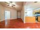 Open living room with hardwood floors and kitchen views at 1121 Whisper Wind Dr, Mcdonough, GA 30253