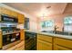 Modern kitchen with stainless steel appliances and ample counter space at 1121 Whisper Wind Dr, Mcdonough, GA 30253