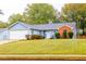 Ranch home with attached garage and landscaped yard at 1121 Whisper Wind Dr, Mcdonough, GA 30253