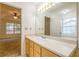 Bathroom with light wood vanity and a large mirror at 1121 Whisper Wind Dr, Mcdonough, GA 30253