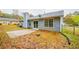 Back exterior view of a charming blue house with a patio at 1121 Whisper Wind Dr, Mcdonough, GA 30253