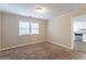 Bright dining room with neutral carpeting and view into kitchen at 3575 Bright Star Rd, Douglasville, GA 30135