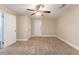 Spacious bedroom with ceiling fan and neutral carpeting at 3575 Bright Star Rd, Douglasville, GA 30135