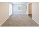 Bright living room with neutral carpeting and French doors at 3575 Bright Star Rd, Douglasville, GA 30135