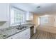 Eat-in kitchen with granite counters and stainless steel appliances at 3575 Bright Star Rd, Douglasville, GA 30135