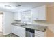 Updated kitchen with white cabinets and granite countertops at 3575 Bright Star Rd, Douglasville, GA 30135