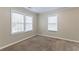 Well lit bedroom with neutral walls and carpet at 3575 Bright Star Rd, Douglasville, GA 30135
