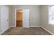 Bedroom with carpet flooring and access to other rooms at 3575 Bright Star Rd, Douglasville, GA 30135