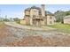Two-story house back view, deck, and driveway at 401 Highway 279, Fayetteville, GA 30214