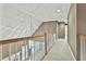 Upstairs hallway with neutral carpeting and light fixture at 401 Highway 279, Fayetteville, GA 30214