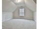 Spacious attic bedroom with window and carpet at 401 Highway 279, Fayetteville, GA 30214