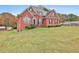 Two-story brick home with a large front yard at 401 Highway 279, Fayetteville, GA 30214