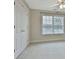 Bright bedroom with double doors and neutral carpeting at 401 Highway 279, Fayetteville, GA 30214