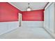 Bright dining room with red walls, white wainscoting, and carpet flooring at 401 Highway 279, Fayetteville, GA 30214