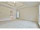 Large main bedroom with plush carpeting and ensuite bathroom access at 401 Highway 279, Fayetteville, GA 30214