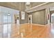 Open concept living room with hardwood floors, kitchen and staircase views at 401 Highway 279, Fayetteville, GA 30214