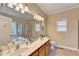 Double vanity bathroom with a large mirror and shower at 39 Legendary Dr, Hoschton, GA 30548