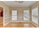 Bright dining room with hardwood floors and wainscoting at 39 Legendary Dr, Hoschton, GA 30548