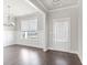 Dining room with hardwood floors and adjacent entryway at 3657 Lockaby Way, Lawrenceville, GA 30044