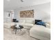 Open loft area featuring a large sectional sofa and modern decor at 3621 Olive Grove Ln, Covington, GA 30016