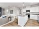 Open concept kitchen with island and stainless steel appliances at 3621 Olive Grove Ln, Covington, GA 30016