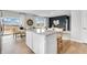 Bright kitchen with an island, granite countertops, and view to backyard at 3621 Olive Grove Ln, Covington, GA 30016