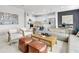 Open concept living room with kitchen, sectional sofa, and accent chairs at 3621 Olive Grove Ln, Covington, GA 30016