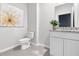 Clean powder room with granite countertop at 3621 Olive Grove Ln, Covington, GA 30016