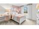 Charming bedroom with a pink theme and built-in desk at 3621 Olive Grove Ln, Covington, GA 30016