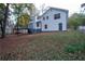 White house back with deck, stairs, and fenced yard at 1143 Cedar Log Pl, Austell, GA 30168