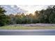 Secluded wooded lot with a paved road nearby, offering privacy and natural beauty at 2950 Miller Bottom Rd, Conyers, GA 30012