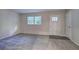 Bright living room with new carpet and neutral walls at 3647 Miller St, Lithia Springs, GA 30122