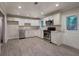 Modern kitchen with stainless steel appliances and white cabinets at 3647 Miller St, Lithia Springs, GA 30122