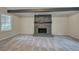 Living room with stone fireplace and wood beam ceiling at 3647 Miller St, Lithia Springs, GA 30122