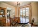 Formal dining room with hardwood floors, large windows, and a charming chandelier at 10 Altar Rock Ne Ct, Cartersville, GA 30121