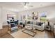 Spacious living room with light grey sofa and wood-toned accents at 6381 Rosetta Dr # 83, South Fulton, GA 30331